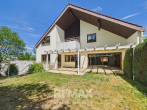 Großzügiges Einfamilienhaus inkl. Einliegerwohnung in ruhiger Lage mit Stellplätzen und Garage zu verkaufen - Gartenansicht